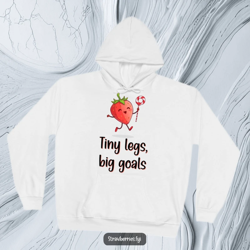 Funny hoodie depicting a cheerful strawberry character with tiny legs skipping rope with a licorice string, offering warmth and humor.