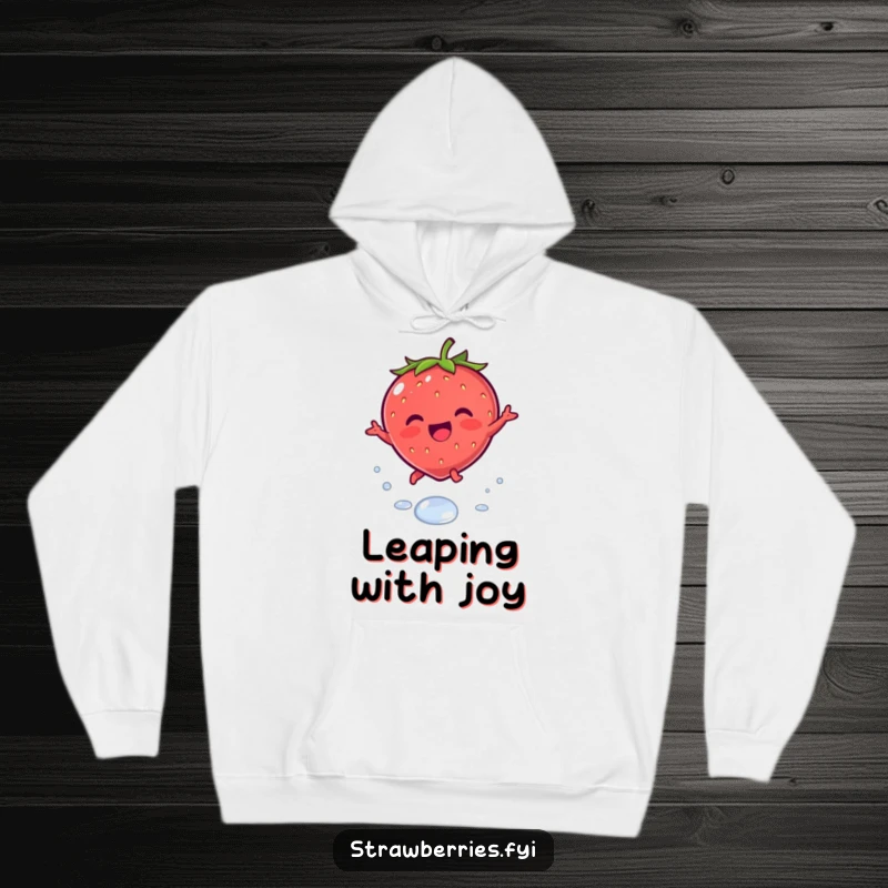 Funny hoodie featuring a joyous kawaii strawberry character leaping playfully over a dewdrop, offering warmth and cute design.