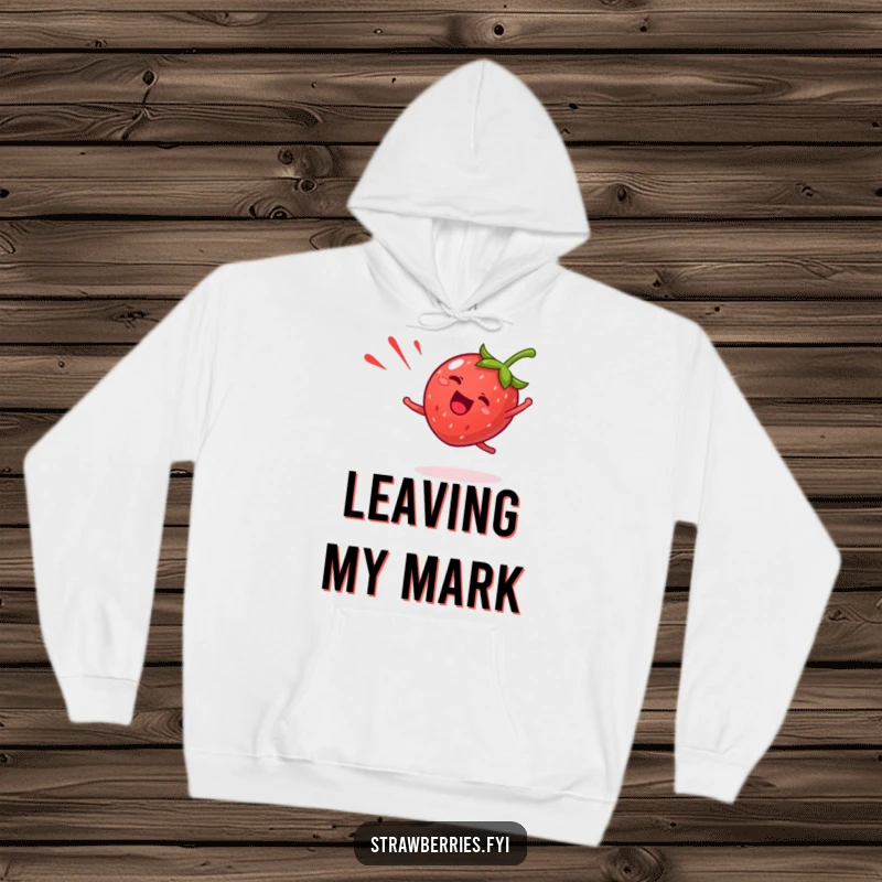 Funny strawberry hoodie featuring a giddy fruit character doing a happy cartwheel with a red streak, offering warm, humorous comfort.