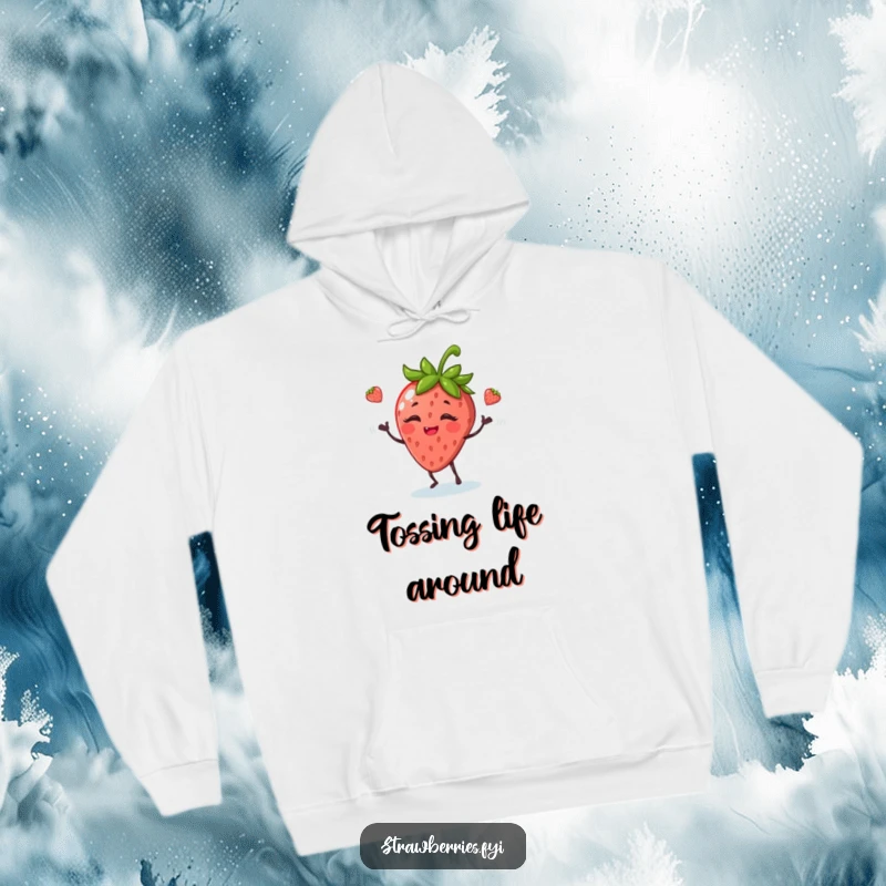 Funny hoodie featuring a giggling anthropomorphic strawberry juggling leaves, exuding a playful and cheerful vibe.