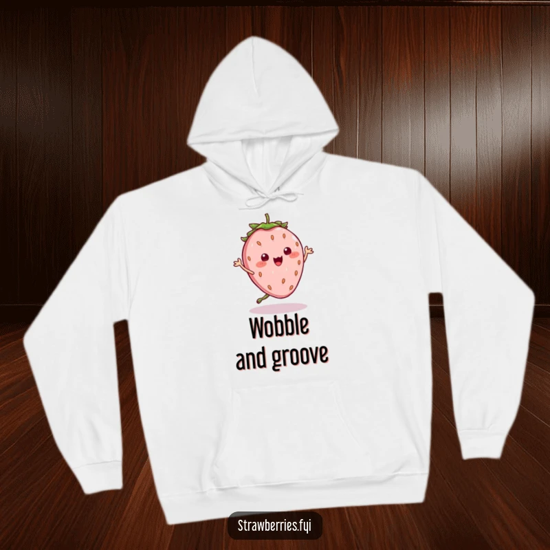 Funny Hoodie: Adorable kawaii strawberry character in a delightful, silly dance pose, seeds wobbling amusingly, perfect for cozy vibes.