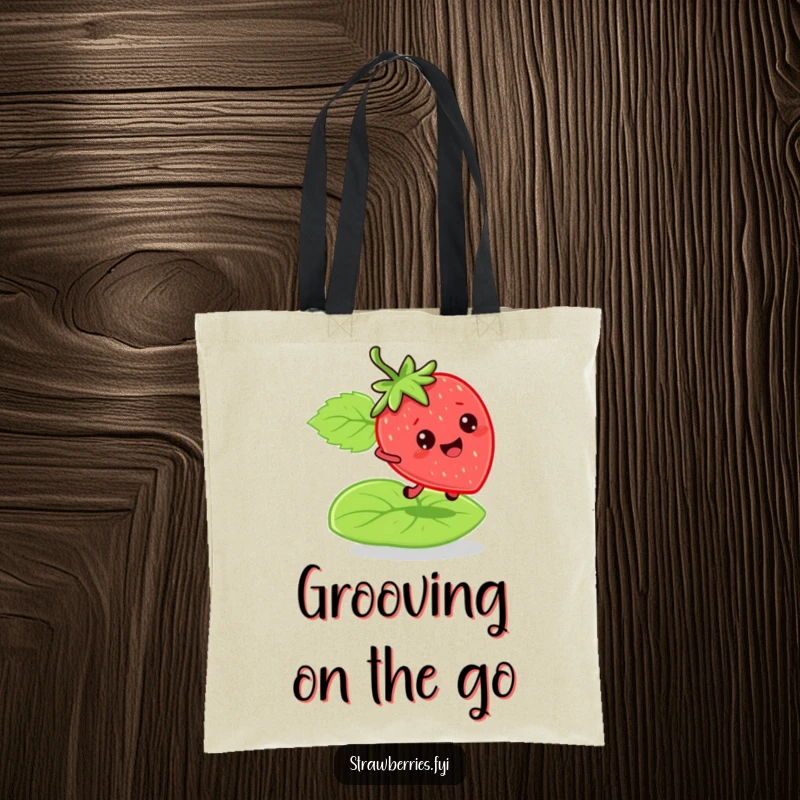 Funny bouncy strawberry tote bag with a character leaping on a green leaf, ideal for carrying items with energetic and humorous flair.