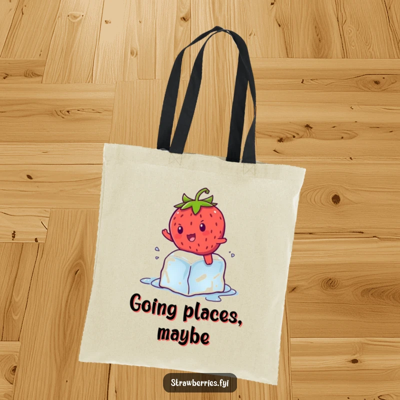 Funny kawaii strawberry character hilariously attempting to balance on a melting ice cube, a comical summer scene on a tote.